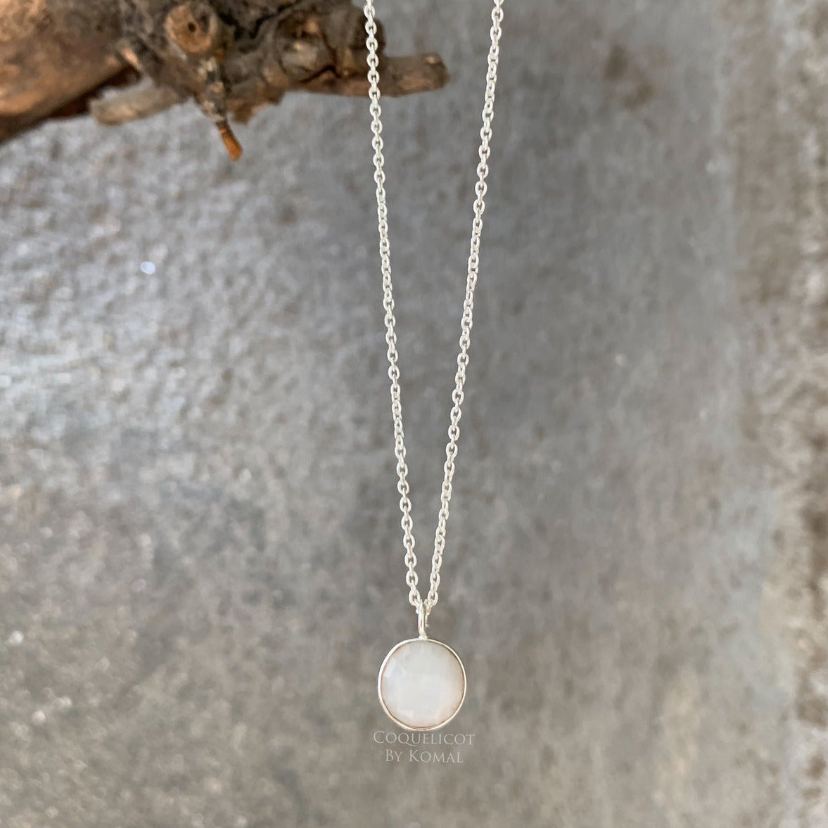 10mm white Rainbow Moonstone pendant placed in a 18 inches chain with fine polish. Handcrafted jewellery that is a unique spiritual gift.